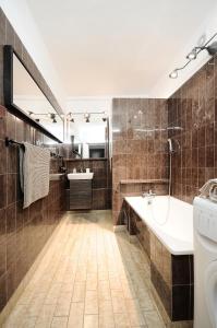 Koupelna v ubytování A Place Like Home Apartamenty Witosa