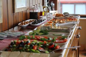 a buffet with many plates of food on a table at Emine Sultan Hotel in Istanbul