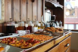 a buffet with many trays of food on a table at Emine Sultan Hotel in Istanbul