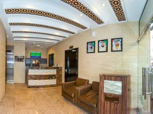 a lobby of a store with a couch and a counter at Florida Square Hotel (Previously known Flora Square Hotel) in Dubai