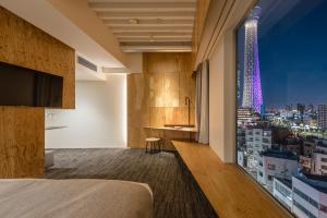 a hotel room with a view of a city at ONE@Tokyo in Tokyo
