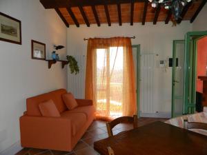 A seating area at Villa il Pino by VacaVilla