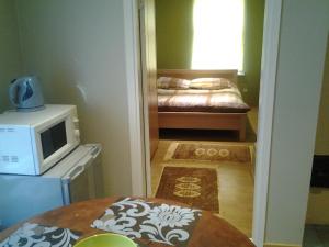 Postel nebo postele na pokoji v ubytování Jaani 2-1 Apartment