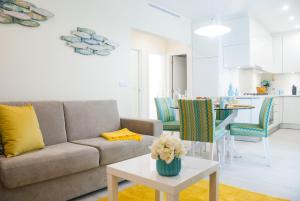 a living room with a couch and a table at Batata - Ocean View in Nazaré
