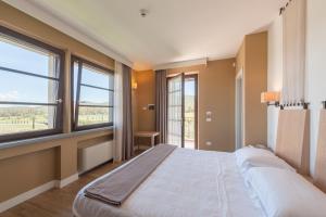 Postel nebo postele na pokoji v ubytování Podere del Priorato