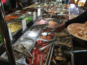 a buffet line with many different types of food at Hotel Royal Garden in Bad Iburg