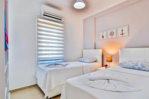 Postel nebo postele na pokoji v ubytování Kasinn Apart Hotel