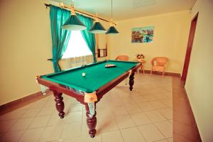 a living room with a pool table in it at Yasnaya Polyana in Arzamas