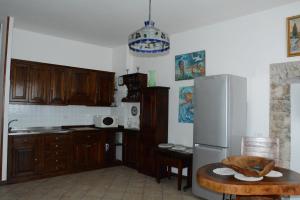 Kuchyň nebo kuchyňský kout v ubytování Maison Huguette