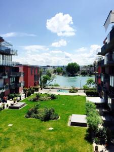 a view of a park with a view of a river at Rhein Melodie riverview luxury in Konstanz