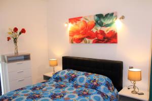 Postel nebo postele na pokoji v ubytování Chimes - Gozo Bellevue Homes + 2 fotografie