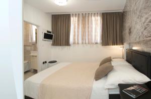 TV a/nebo společenská místnost v ubytování Apartment & Room Split Lea