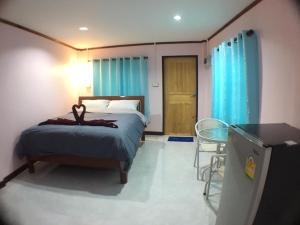 Кровать или кровати в номере Smile Resort