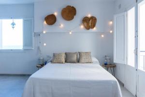 Postel nebo postele na pokoji v ubytování Blancos Rooms Hotel