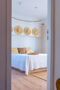 Postel nebo postele na pokoji v ubytování Blancos Rooms Hotel