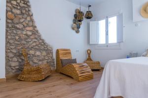 Postel nebo postele na pokoji v ubytování Blancos Rooms Hotel
