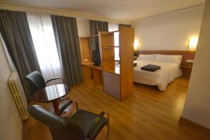 Postel nebo postele na pokoji v ubytování Hotel Brujas De Irues