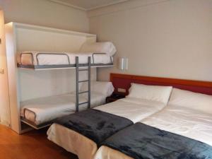 Postel nebo postele na pokoji v ubytování Hotel Brujas De Irues