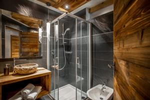 a bathroom with a shower and a sink at Chalet Stefan - Apartments in La Villa +38 photos