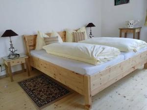 Postel nebo postele na pokoji v ubytování Gartler's Appartements