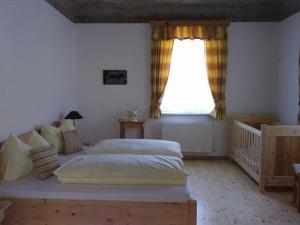 Postel nebo postele na pokoji v ubytování Gartler's Appartements