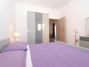 Postel nebo postele na pokoji v ubytování Apartments Mira 1293
