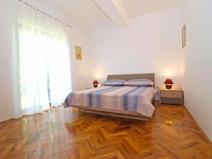 Postel nebo postele na pokoji v ubytování Apartments Mira 1293