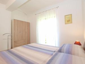 Postel nebo postele na pokoji v ubytování Apartments Mira 1293