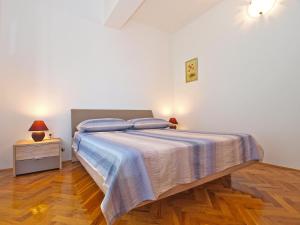 Postel nebo postele na pokoji v ubytování Apartments Mira 1293