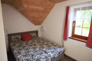Ένα ή περισσότερα κρεβάτια σε δωμάτιο στο Apartmany Svijany