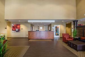 a lobby with a reception desk in a hospital at Comfort Suites Regina in Regina +21 photos