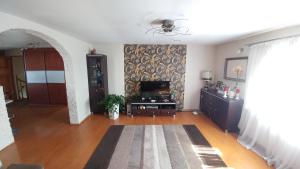 TV a/nebo společenská místnost v ubytování Apartament Łebcz + 6 fotografií