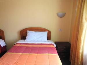 Katil atau katil-katil dalam bilik di Hostal Lucerito