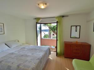 Postel nebo postele na pokoji v ubytování Apartments Fabijanić