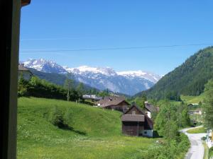 a view of a valley with snow covered mountains at Haus Mary in Russbach am Pass Gschütt