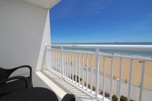 a balcony with a view of the beach and the ocean at Ocean Sands Resort, Oceanfront, Virginia Beach by Vacatia in Virginia Beach +64 photos