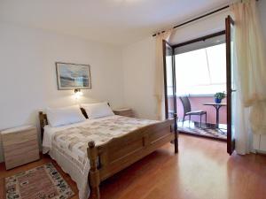 Postel nebo postele na pokoji v ubytování Apartments Fabijanić