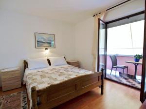 Postel nebo postele na pokoji v ubytování Apartments Fabijanić