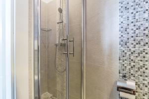 a shower with a glass door in a bathroom at Apartments Lavanda & Rozmarin in Split +44 photos