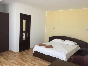 Postel nebo postele na pokoji v ubytování Vila DG