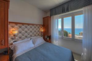 Кровать или кровати в номере Hotel Noris
