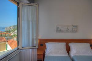 Кровать или кровати в номере Hotel Noris