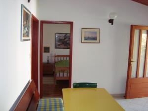 Postel nebo postele na pokoji v ubytování Apartments Lovor