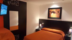 Postel nebo postele na pokoji v ubytování Sur Hotel