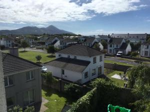 a city with houses and mountains in the background at 19 Westlands in Westport