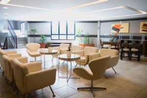 Area soggiorno di Class Hotel Varginha