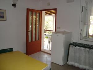 Kuchyň nebo kuchyňský kout v ubytování Apartments Lovor