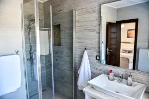 a bathroom with a sink and a shower at Villa Premier in Ulcinj +39 photos