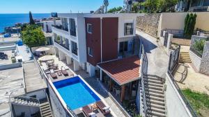 an aerial view of a building with a swimming pool at Villa Premier in Ulcinj