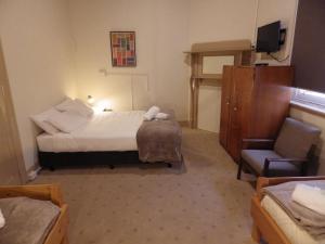 Postel nebo postele na pokoji v ubytování Delatite Hotel